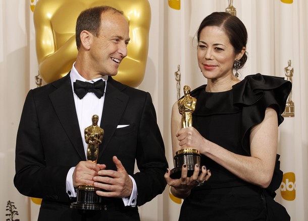 Charles Ferguson and Audrey Marrs pose Oscars.